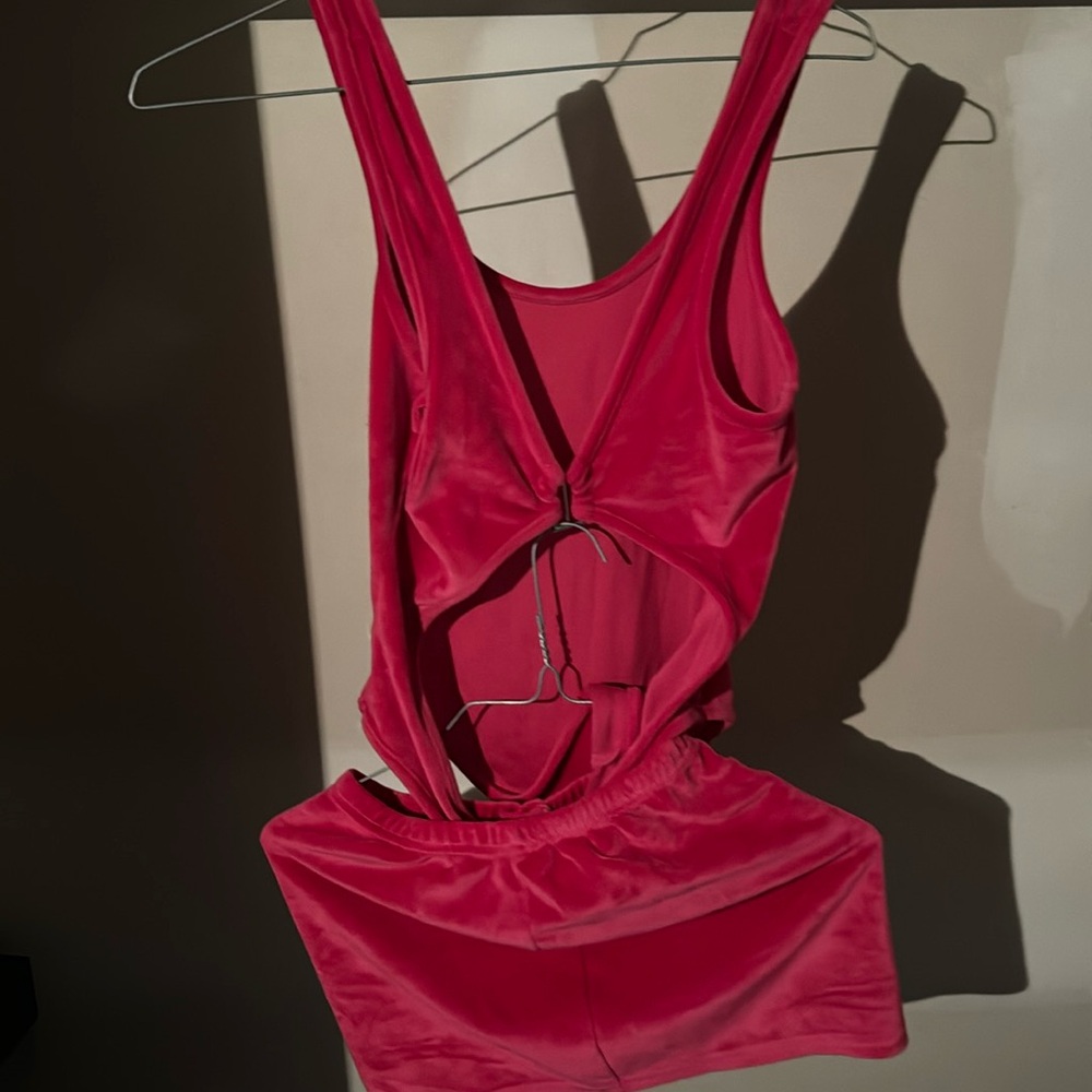 Two piece hot pink polyester bodysuit and skirt set